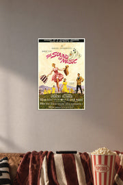 The Sound of Music Movie Poster in a cozy movie room above a brown sofa with popcorn.