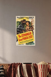 The Stranger from Ponca City Charles Starrett Smiley Burnette Western Movie in a cozy movie room above a brown sofa with popcorn.