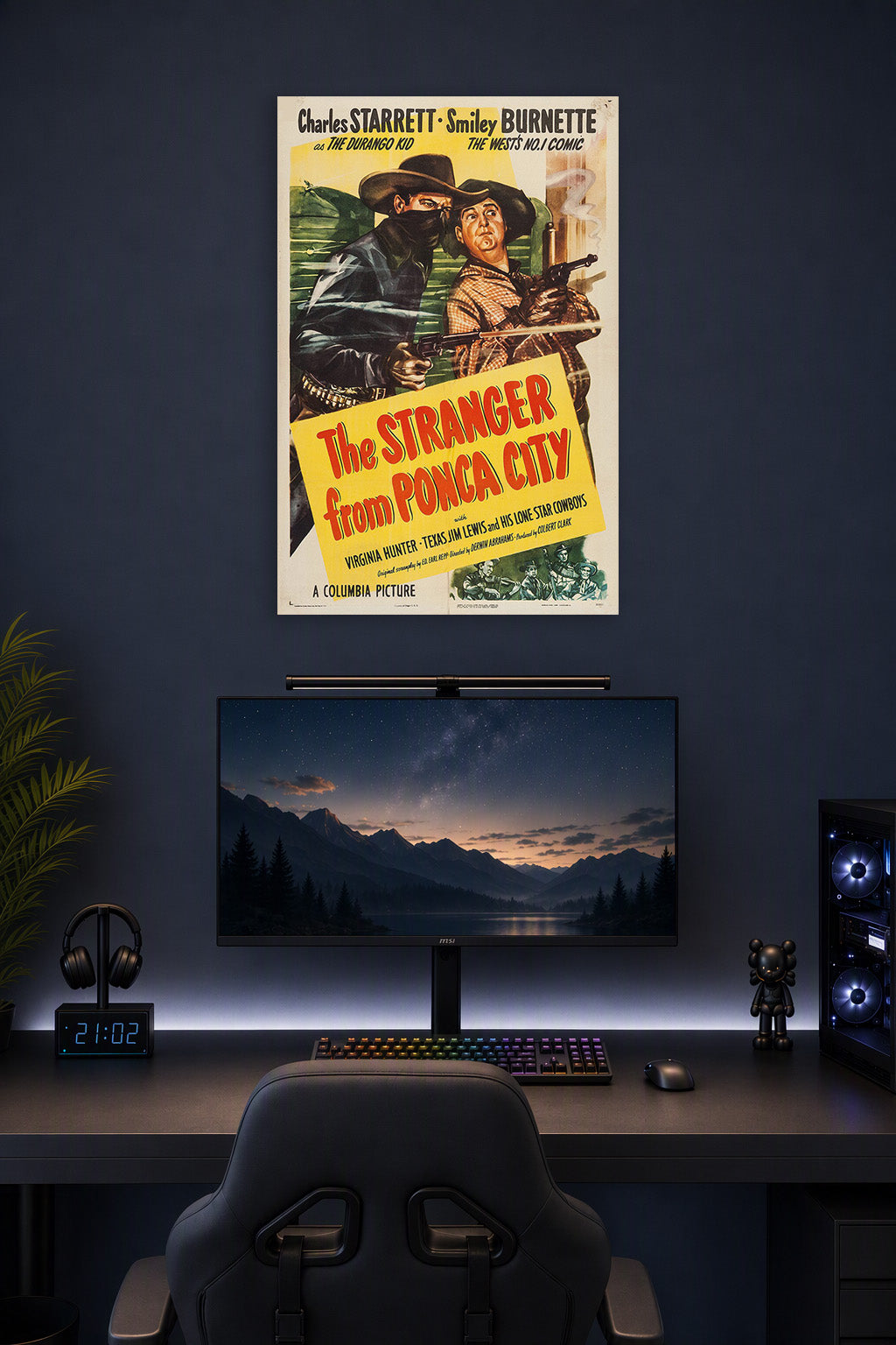 The Stranger from Ponca City Charles Starrett Smiley Burnette Western Movie in a gaming desk setup above a monitor.