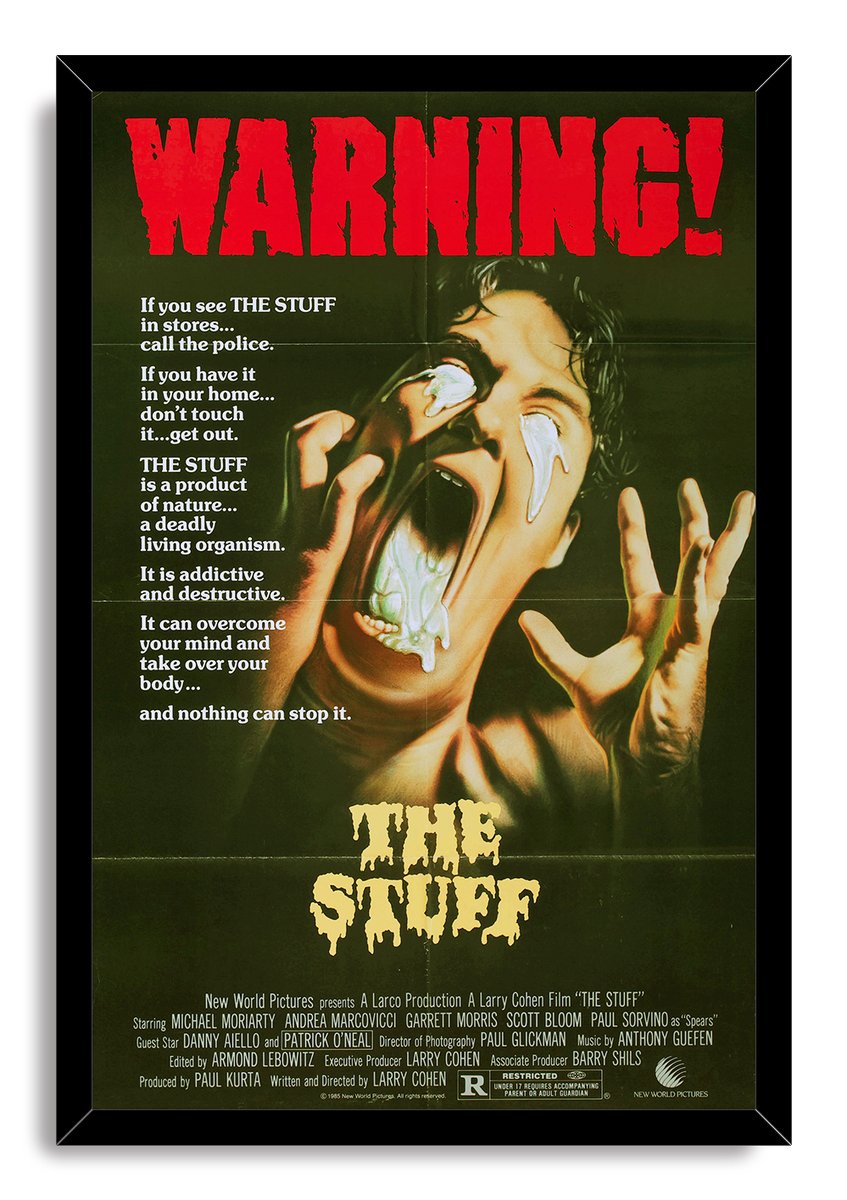 The Stuff framed wall art print features a black frame around the horror poster of a screaming man with white dripping substance.
