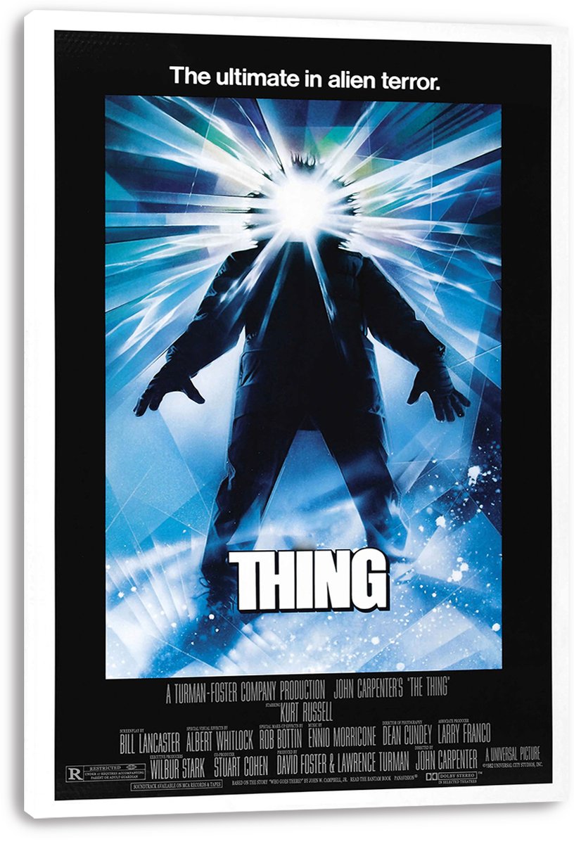 The Thing canvas wall art print displays a silhouetted figure with a radiant white head against icy blue fractured beams.