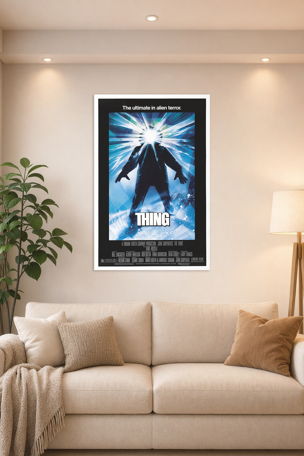 The Thing in a bright living room above a beige sofa.