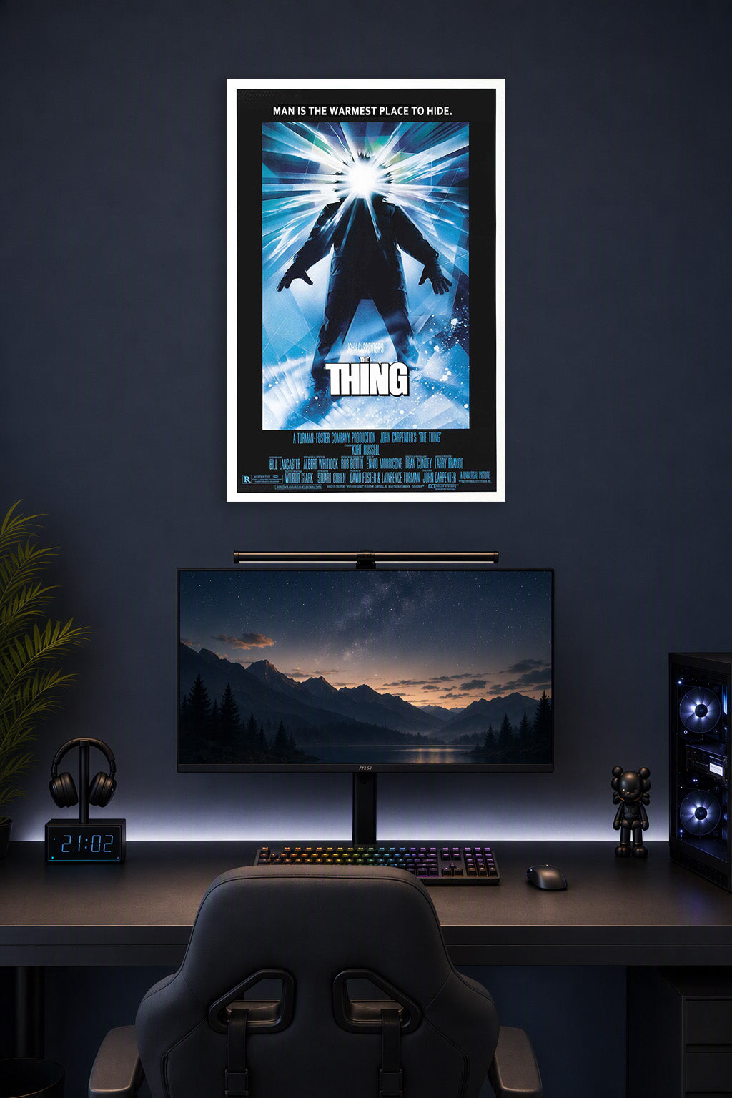 The Thing Movie in a gaming desk setup above a monitor.