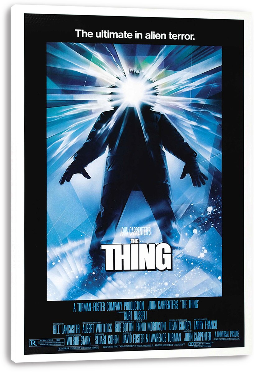 The Thing canvas wall art print displayed with white wrapped edges, featuring a silhouetted figure and bright blue-white burst of light.