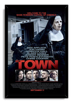 The Town framed wall art print presents two masked nun robbers with guns, an armored truck, actor portraits, and red lettering.