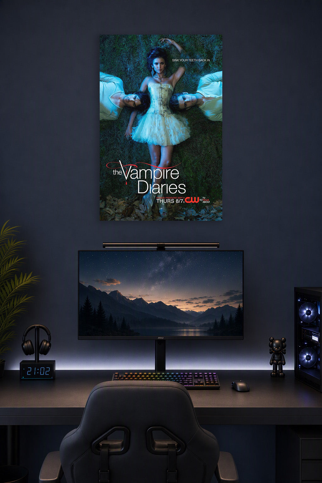 The Vampire Diaries Cast in a gaming desk setup above a monitor.