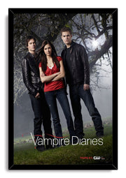 The Vampire Diaries framed wall art print depicting Elena, Damon, and Stefan standing on grass before foggy twisted trees.