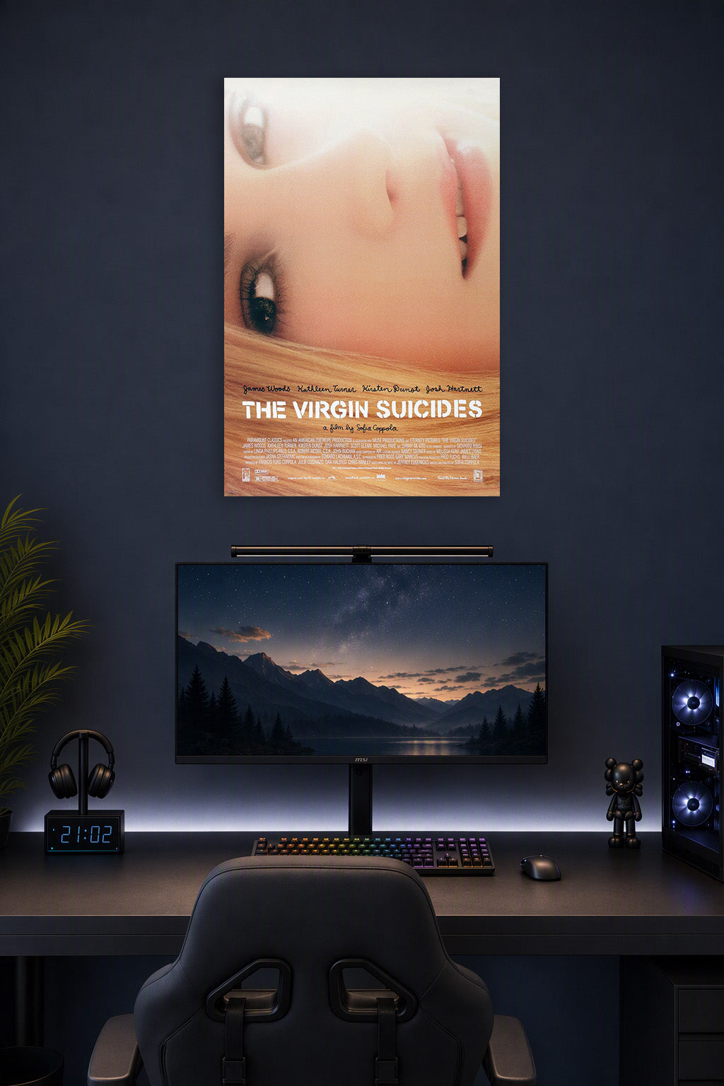 The Virgin Suicides Movie Poster in a gaming desk setup above a monitor.