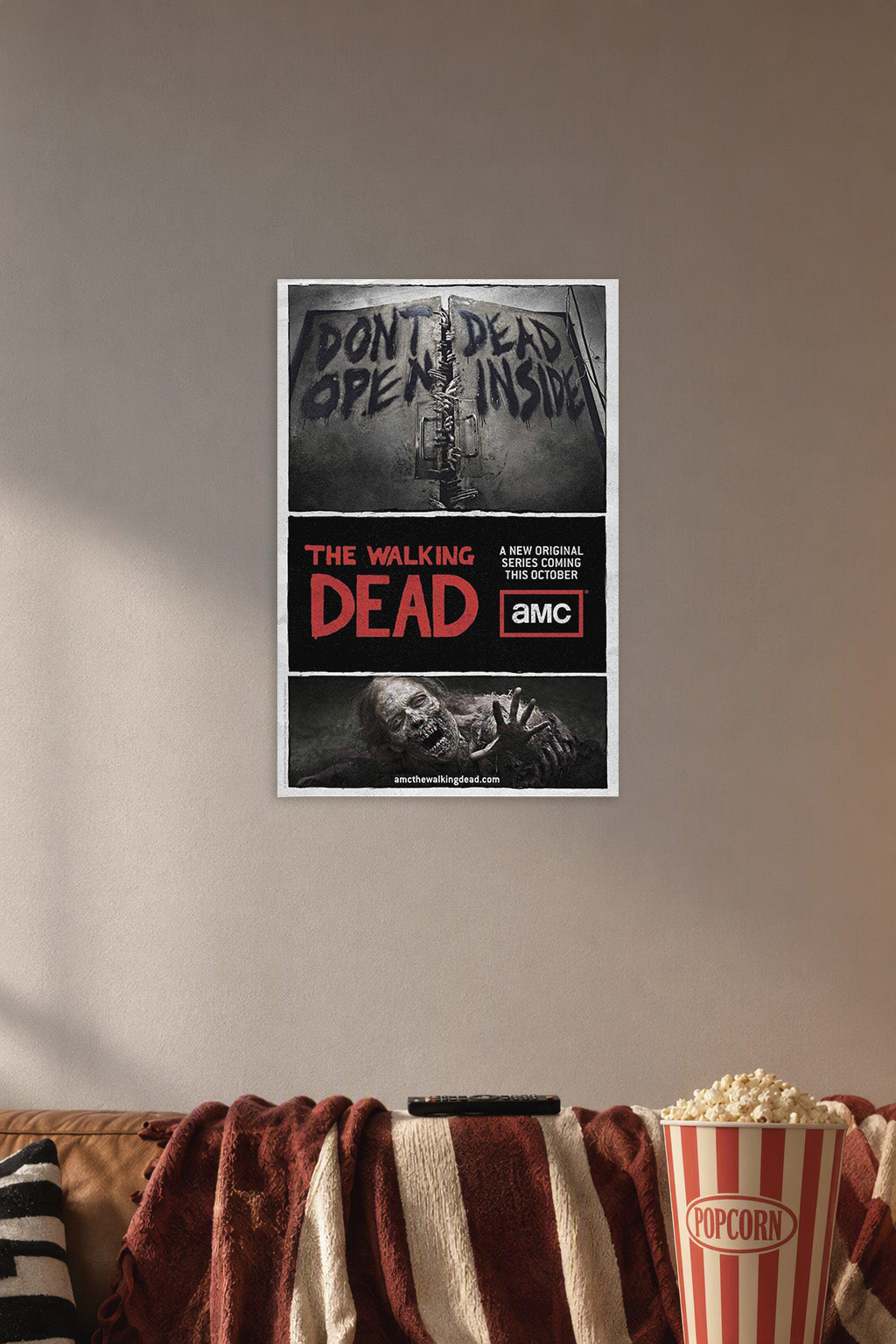 The Walking Dead Don't Open Dead Inside in a cozy movie room above a brown sofa with popcorn.