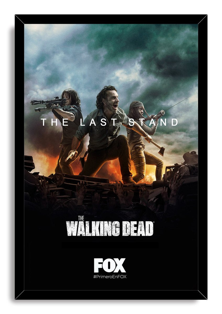 The Walking Dead framed wall art print, The Last Stand, depicting three survivors defending themselves above wreckage under a dark, smoky sky.