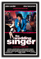 The Wedding Singer framed wall art print features a singer in blue performing beside a waitress and band, set in a black frame.