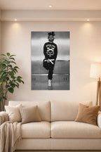 The Weeknd in a bright living room above a beige sofa.
