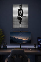 The Weeknd in a gaming desk setup above a monitor.