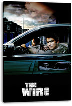 The Wire canvas wall art print displays three men inside a dark car, an urban street beneath stormy clouds, and distressed white lettering.