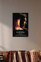 There Will Be Blood in a cozy movie room above a brown sofa with popcorn.