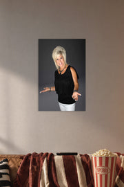 Theresa Caputo in a cozy movie room above a brown sofa with popcorn.