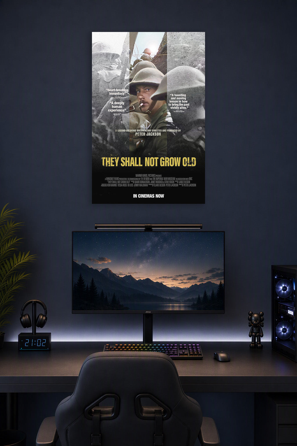 They Shall Not Grow Old Movie Poster in a gaming desk setup above a monitor.