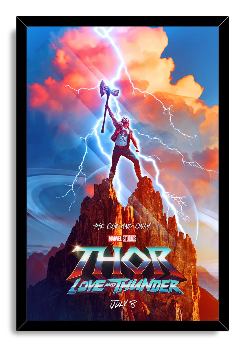 Thor Love and Thunder framed wall art print features Thor wielding Stormbreaker above a mountain, surrounded by lightning and orange-blue skies.