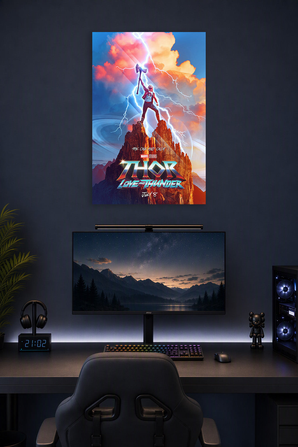Thor Love and Thunder in a gaming desk setup above a monitor.