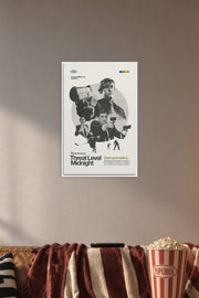 Threat Level Midnight Movie Poster in a cozy movie room above a brown sofa with popcorn.