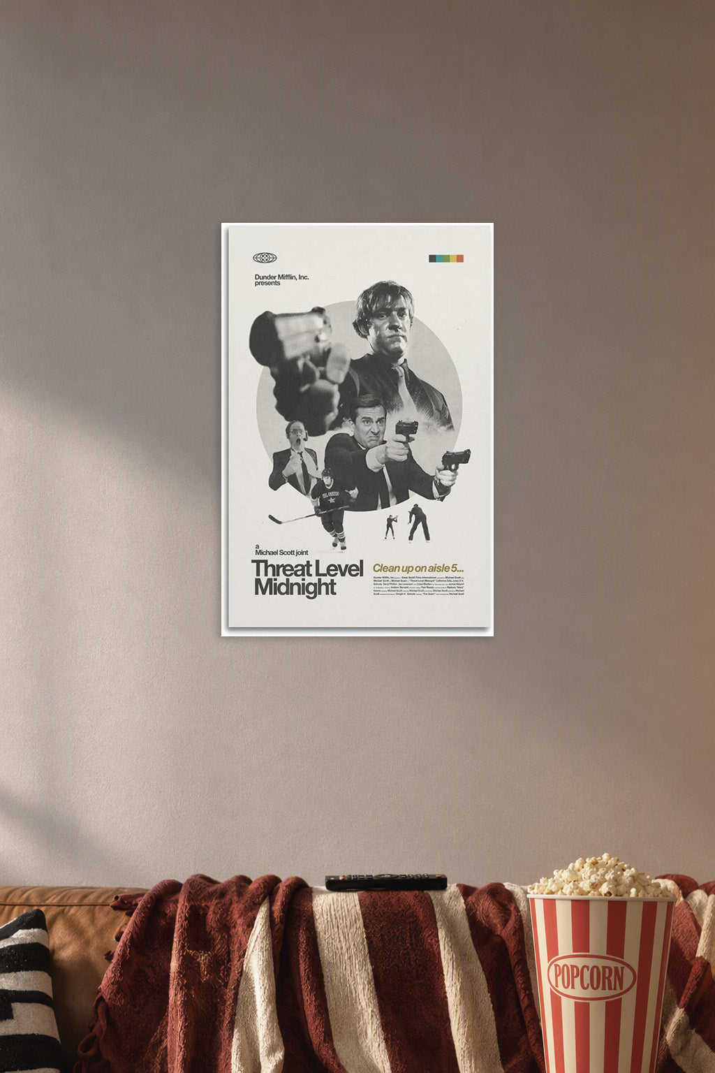 Threat Level Midnight Movie Poster in a cozy movie room above a brown sofa with popcorn.