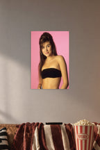 Tiffani Thiessen in a cozy movie room above a brown sofa with popcorn.