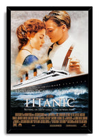 Titanic movie poster wall art print in a black frame, with Jack and Rose above the RMS Titanic on dark waves.