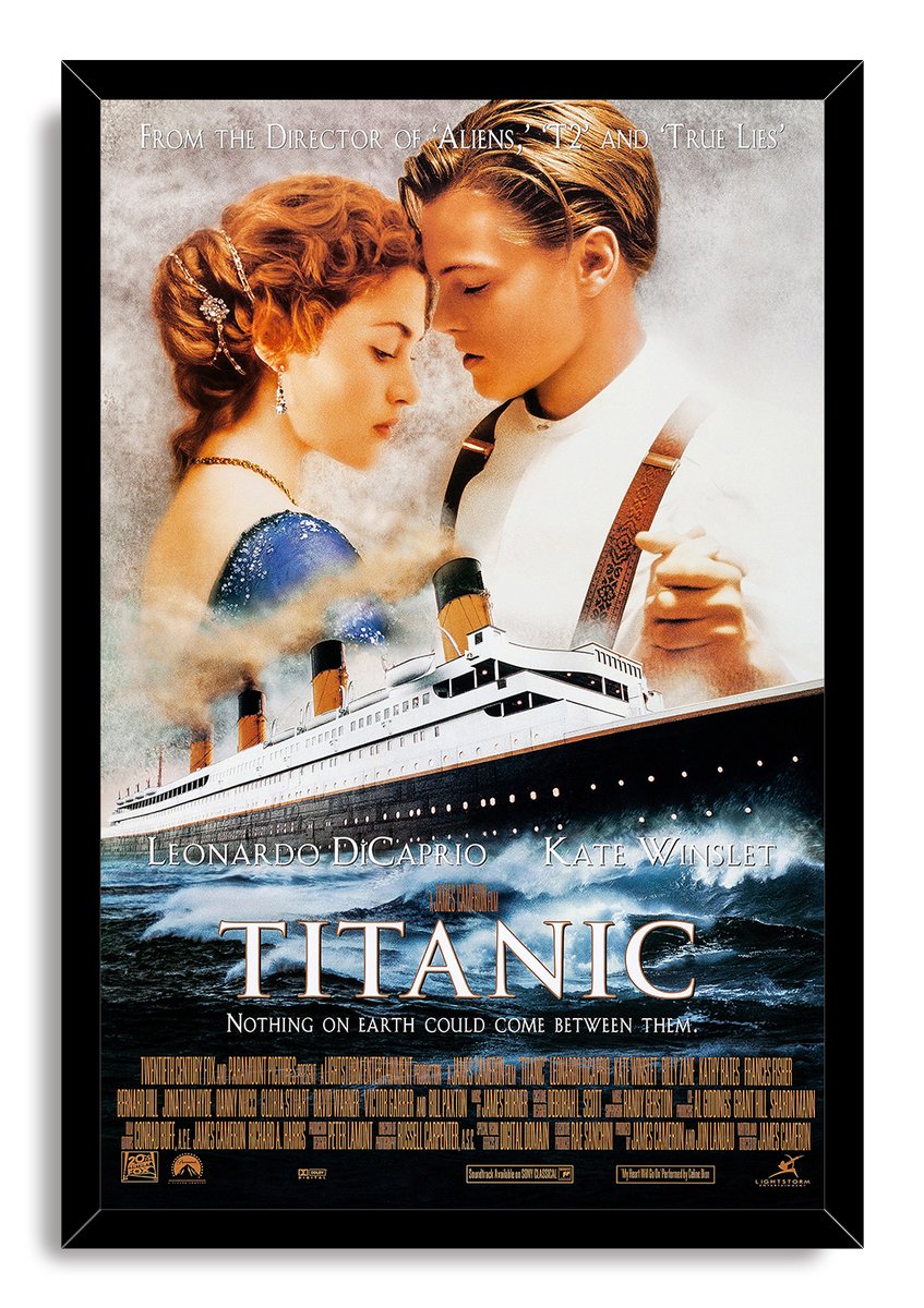 Titanic movie poster wall art print in a black frame, with Jack and Rose above the RMS Titanic on dark waves.