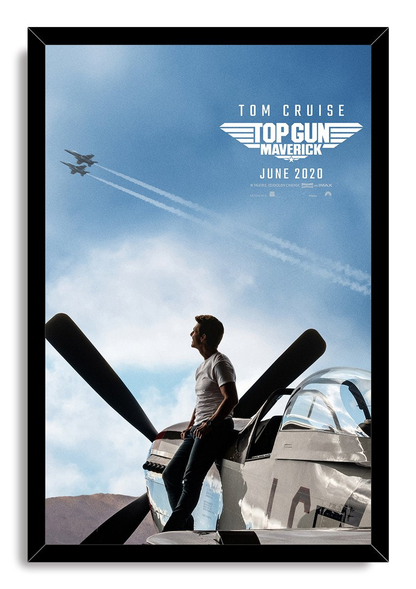 Framed Top Gun Maverick wall art print with Tom Cruise beside a fighter jet and two aircraft flying overhead.