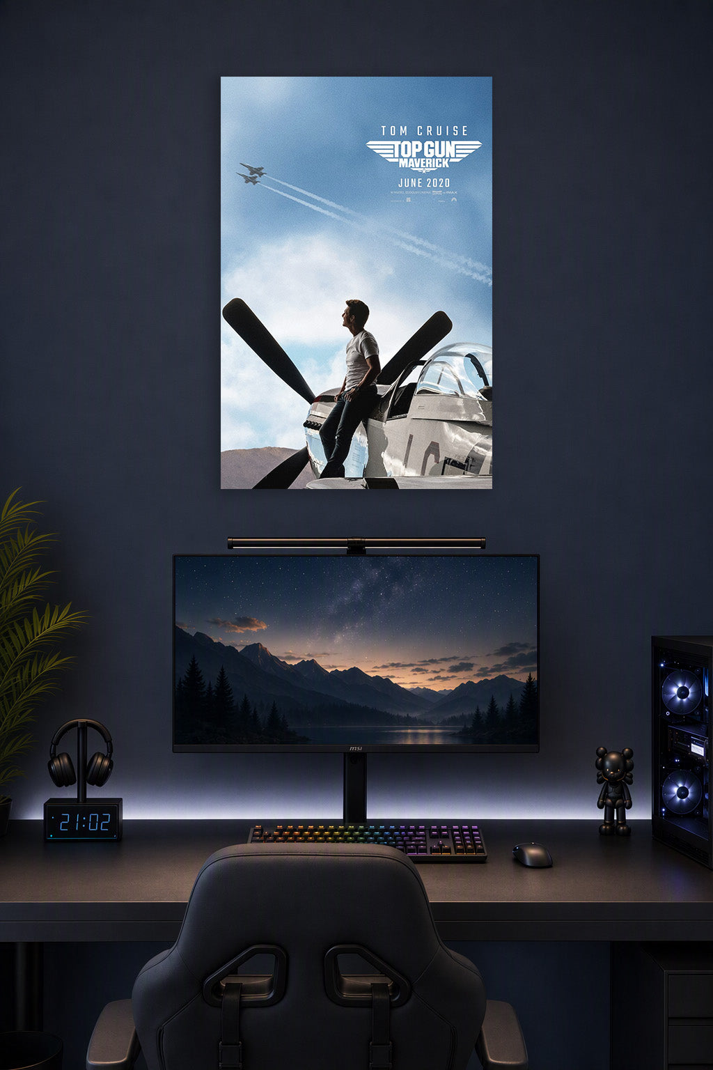 Tom Cruise Top Gun Maverick in a gaming desk setup above a monitor.