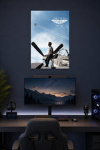 Tom Cruise Top Gun Maverick in a gaming desk setup above a monitor.