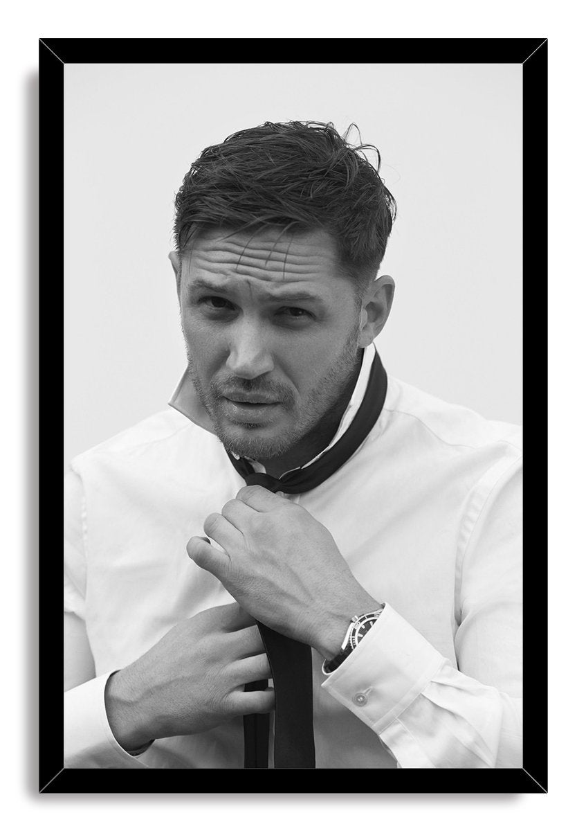Tom Hardy framed wall art print with a black border, portraying him in a white shirt as he adjusts his dark tie.
