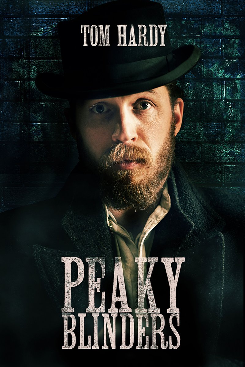 Tom Hardy Peaky Blinders poster featuring a bearded man in a black hat and coat against a dark blue brick wall.