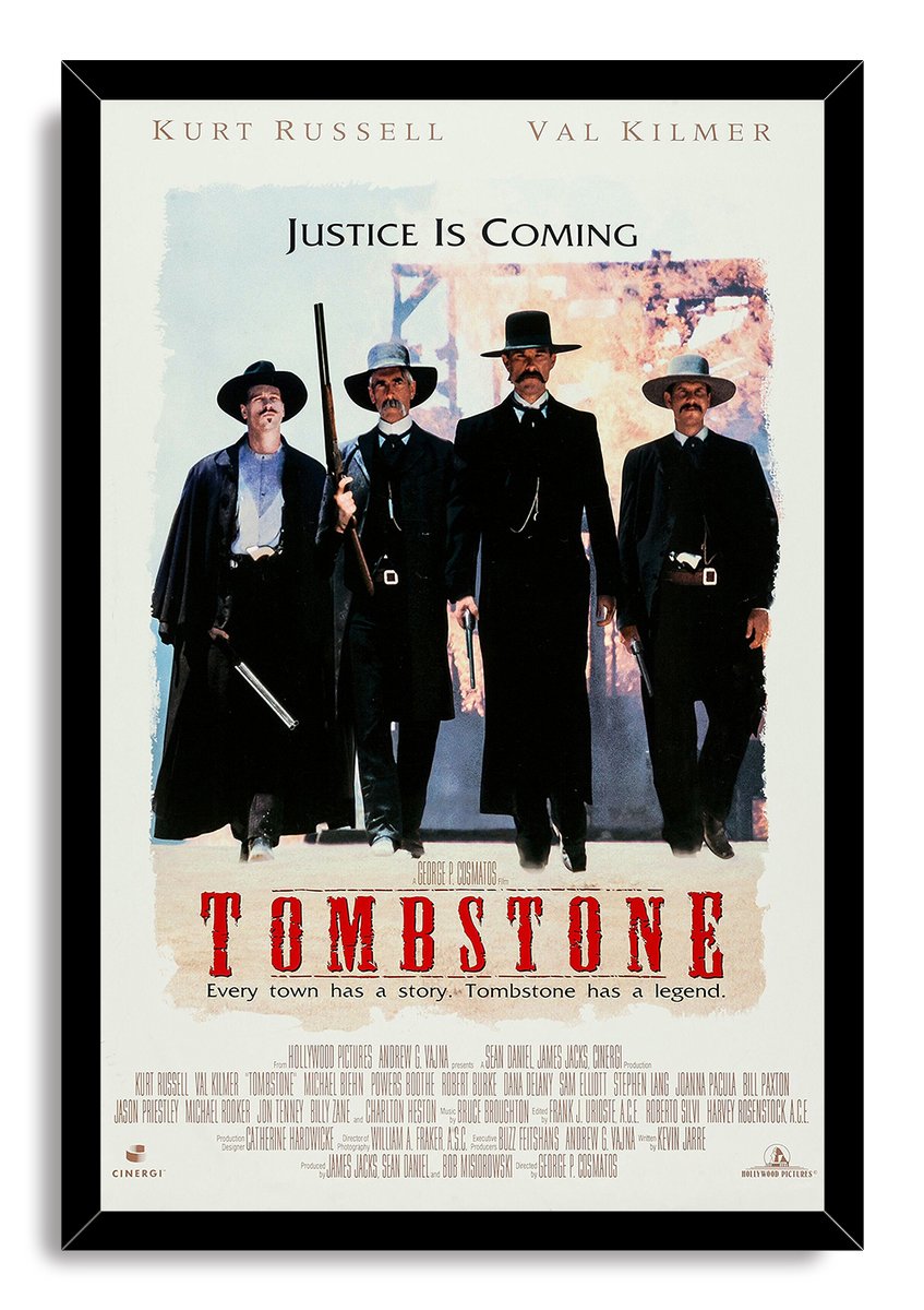 Tombstone movie framed wall art print with four Western gunmen, Justice Is Coming text, and a black mitered frame.