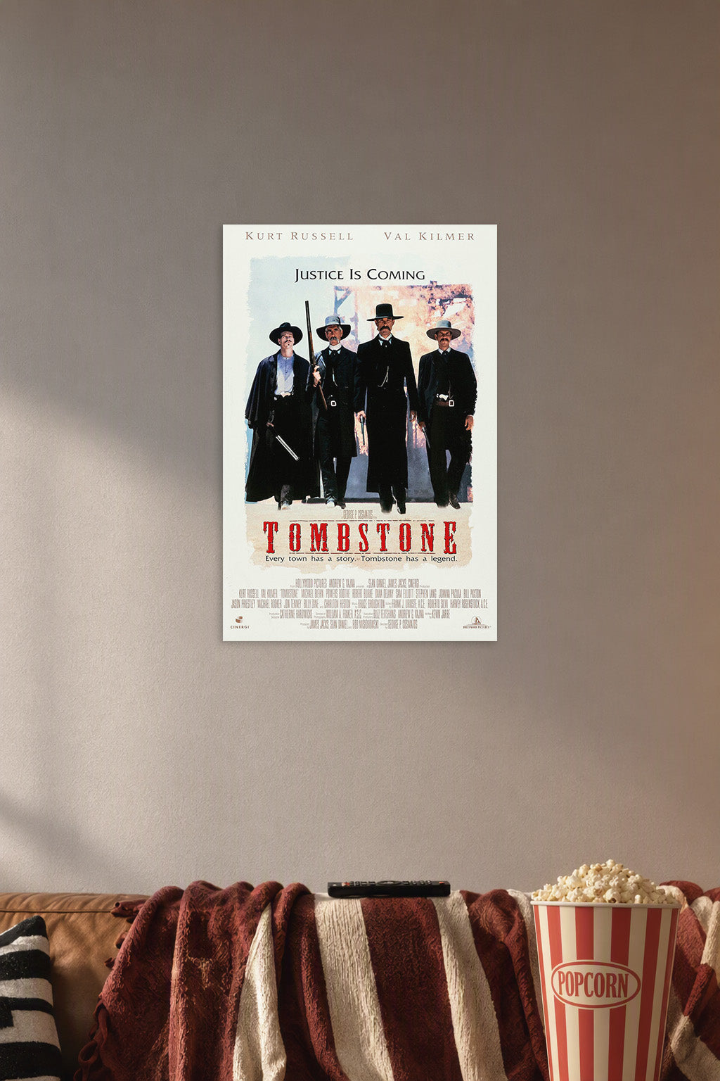Tombstone Movie Poster Earp Brothers Doc Holliday Western in a cozy movie room above a brown sofa with popcorn.