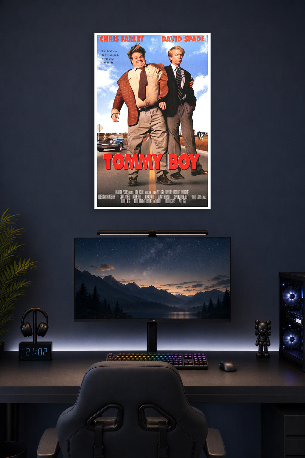 Tommy Boy Movie Chris Farley David Spade in a gaming desk setup above a monitor.
