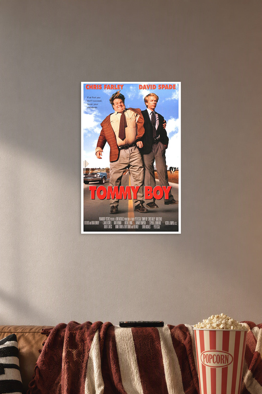 Tommy Boy Movie Chris Farley David Spade in a cozy movie room above a brown sofa with popcorn.