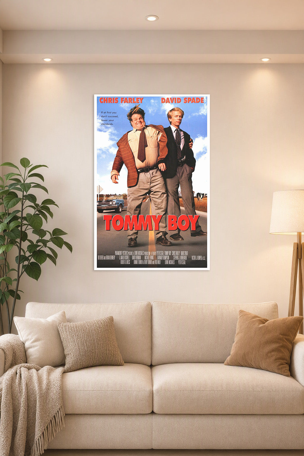 Tommy Boy Movie Chris Farley David Spade in a bright living room above a beige sofa.