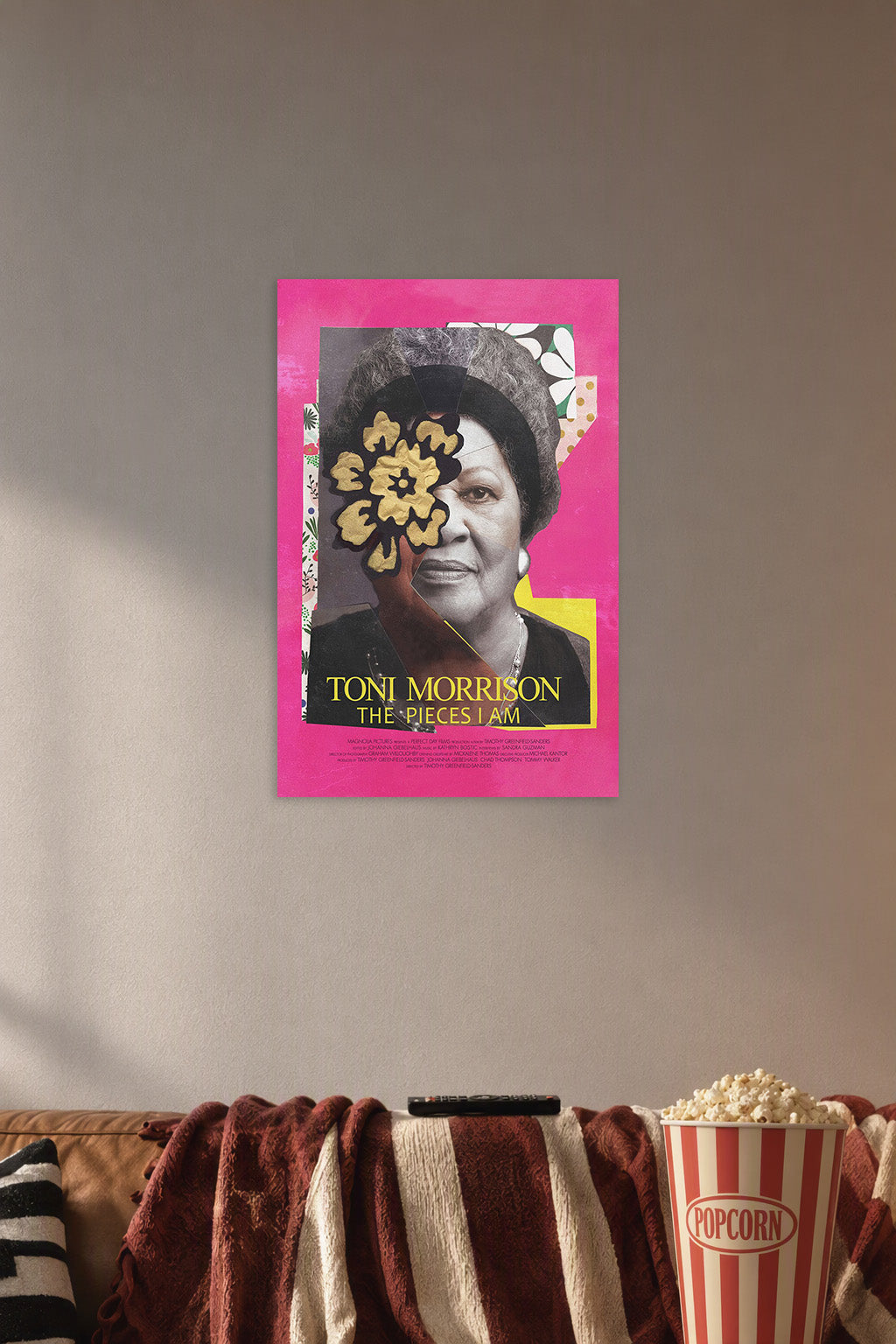 Toni Morrison in a cozy movie room above a brown sofa with popcorn.