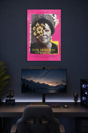 Toni Morrison in a gaming desk setup above a monitor.
