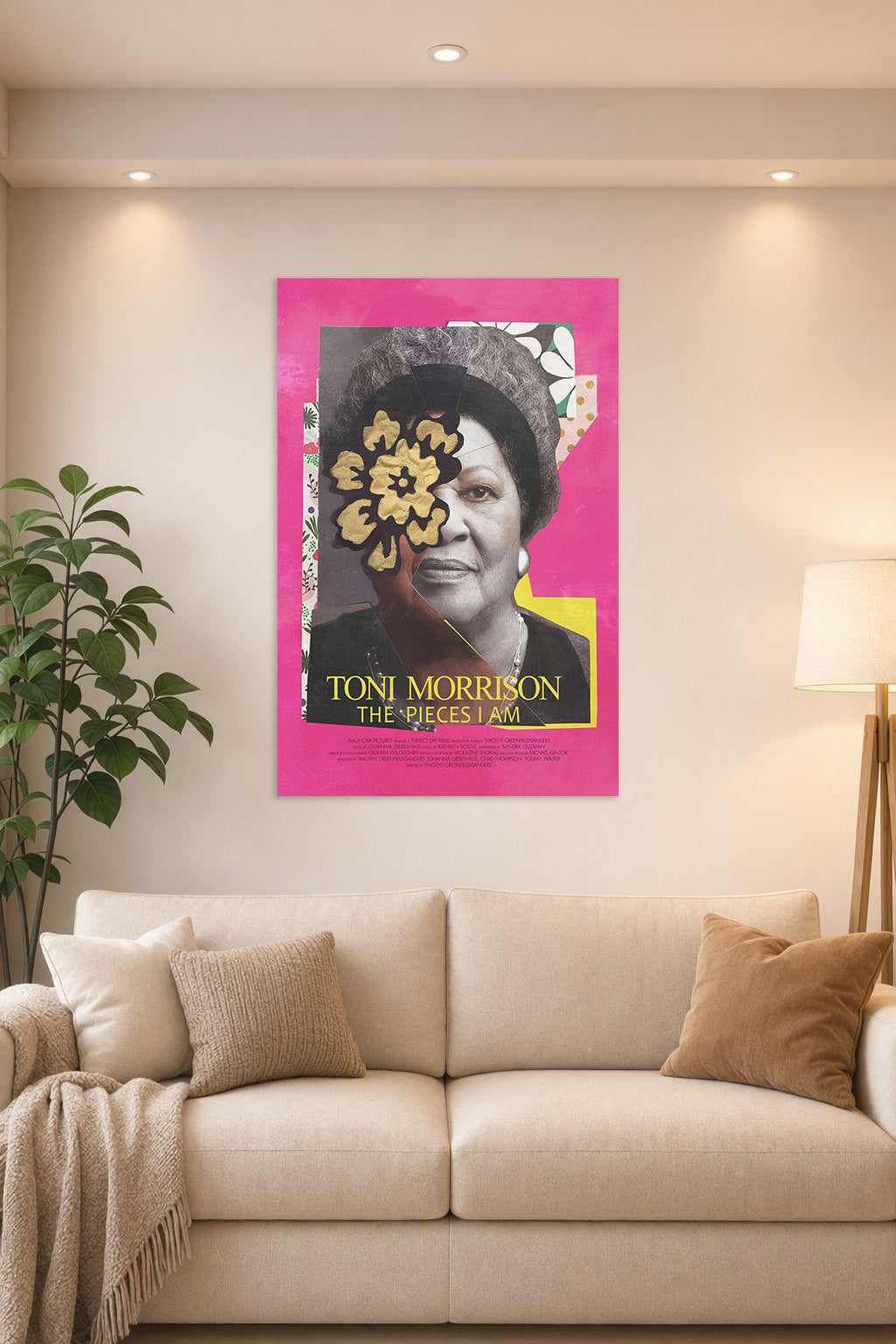 Toni Morrison in a bright living room above a beige sofa.