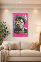 Toni Morrison in a bright living room above a beige sofa.
