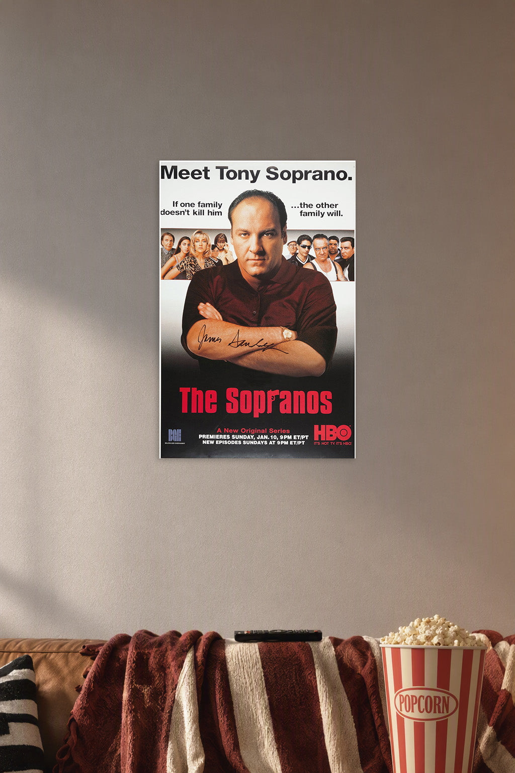 Tony Soprano The Sopranos TV Show in a cozy movie room above a brown sofa with popcorn.