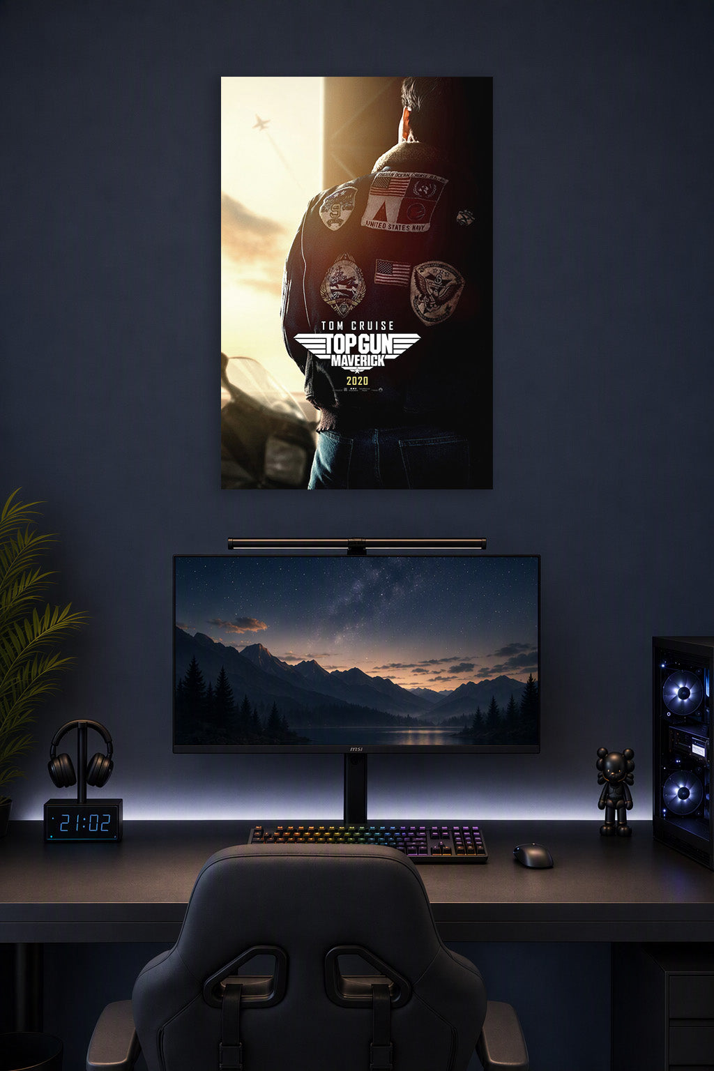 Top Gun Maverick Tom Cruise in a gaming desk setup above a monitor.