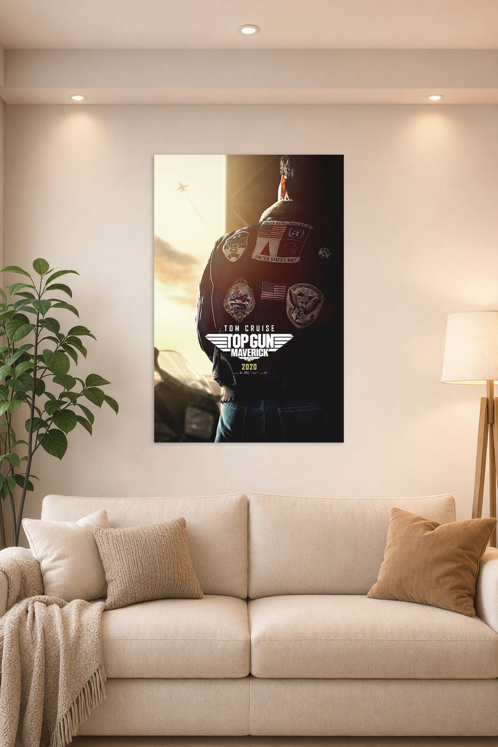Top Gun Maverick Tom Cruise in a bright living room above a beige sofa.