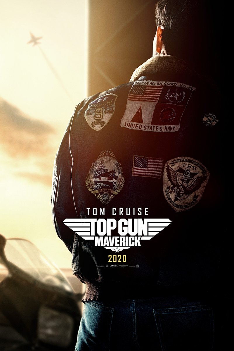 Top Gun Maverick poster features Tom Cruise from behind in a patch-covered flight jacket beneath a warm sunset and distant jet.
