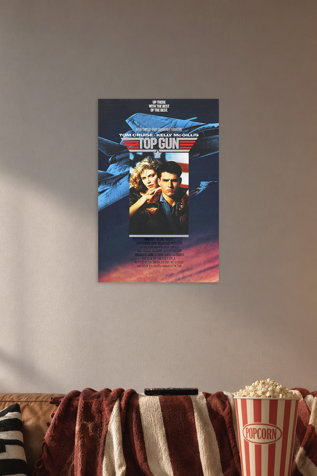 Top Gun Movie in a cozy movie room above a brown sofa with popcorn.