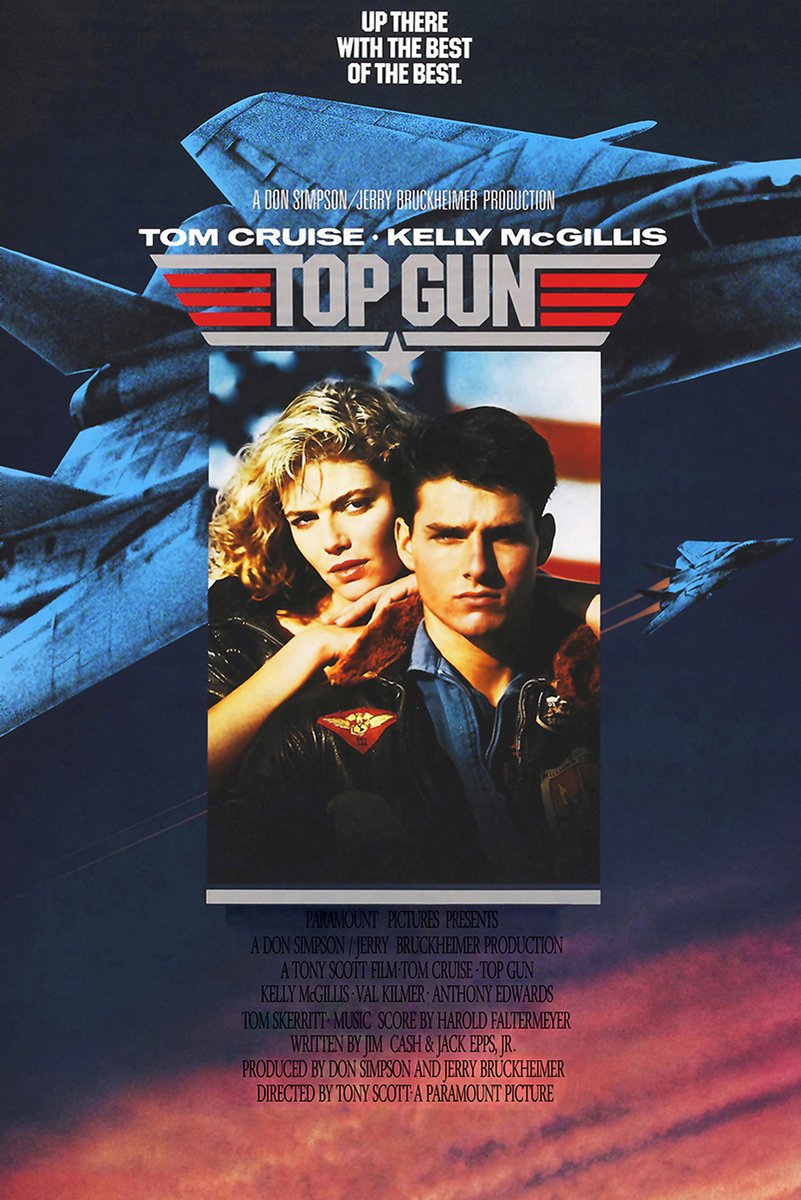 Top Gun movie poster print with Tom Cruise and Kelly McGillis beneath fighter jets, bold red logo, and sunset clouds.