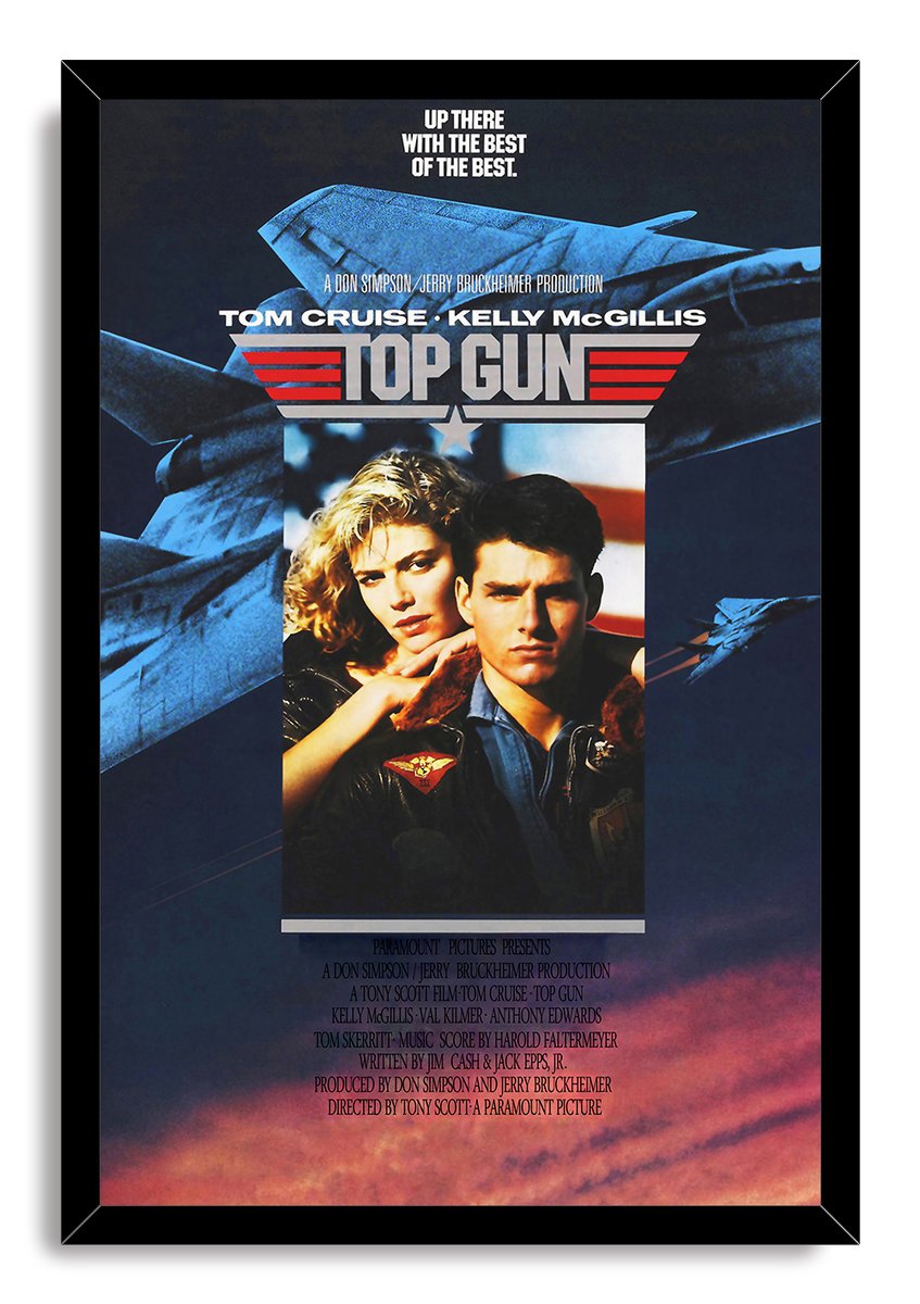 Top Gun framed wall art print with a black border, Tom Cruise and Kelly McGillis portrait, fighter jets, and glowing sunset clouds.