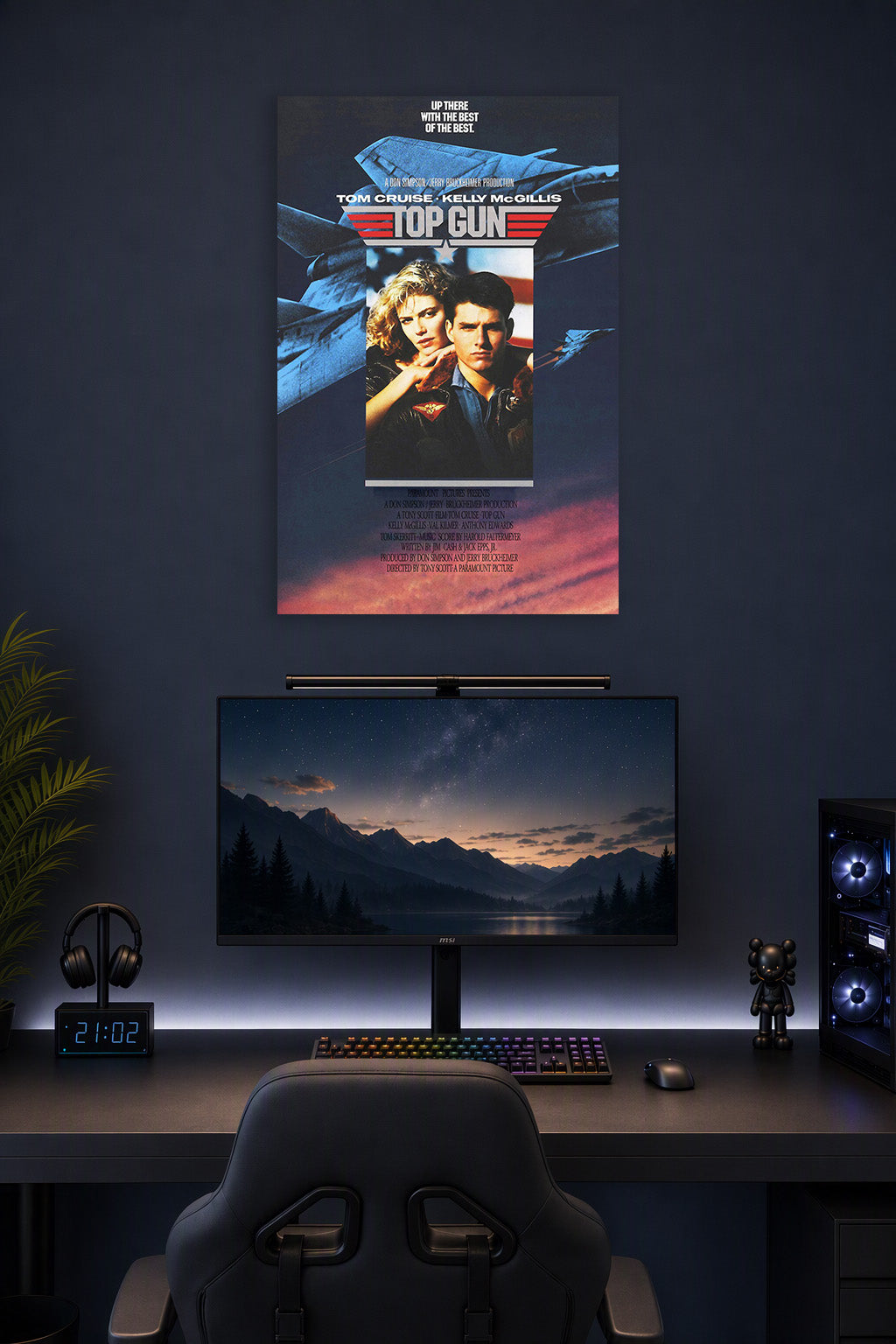 Top Gun Movie Poster Tom Cruise Kelly McGillis in a gaming desk setup above a monitor.